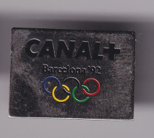 Pin's JO Barcelona 92 Canal+ Réf 8416 - Olympische Spiele