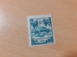 TIMBRE   GUADELOUPE   TAXE    N  42    COTE  0,50   EUROS  NEUF  TRACE  CHARNIERE - Timbres-taxe