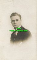 R611214 A Young Man In A Suit. Portrait. T. I. C - Welt