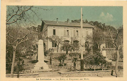 83* LE LAVANDOU Ecole Et Monument Aux Morts       MA107,0318 - Le Lavandou