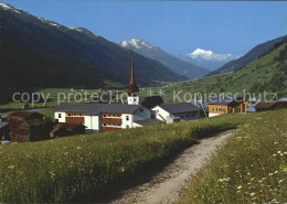 11695280 Muenster VS Ortsblick Mit Kirche Und Weisshorn Muenster VS - Autres & Non Classés