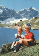 11692178 Melchsee-Frutt Trachtenkinder Melchsee-Frutt - Altri & Non Classificati