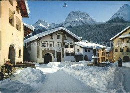 11691824 Scuol Verschneiter Dorfplatz Mit Lischanagruppe Scuol - Autres & Non Classés