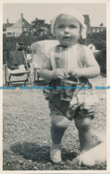 R024868 Old Postcard. Baby On The Beach - World