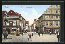 AK Saaz, Pragergasse Mit Apotheke Und Geschäft Von Ludwig Lowi Und Josef Strauss  - Tschechische Republik