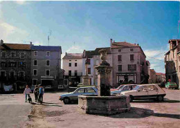 Automobiles - Chambon Le Château - Place Centrale Et Ses Commerces - CPM - Voir Scans Recto-Verso - Voitures De Tourisme