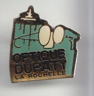 Pin's Optique Dupatty La Rochelle En Charente Maritime Dpt 17 Paire De Lunette Réf 5920 - Städte