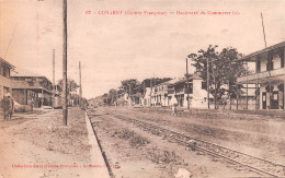 GUINEE Française  CONAKRY Boulevard Du Commerce Carte Vierge Non Circulé éd JAMES (Scan R/V) N° 5 \MP7133 - Guinea Francesa