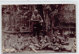 PAPUA NEW GUINEA - Papuan Chief And His Nude Wives - REAL PHOTO - Publ. W. H. Cooper. - Papua Nuova Guinea