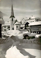 13870696 Flond GR Dorfpartie Mit Kirche Im Winter  - Autres & Non Classés