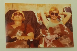 Two Women With Sunglasses Enjoying The Sun - Anonymous Persons