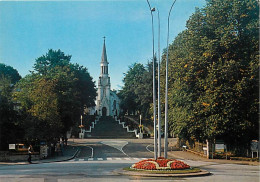 61 - Bagnoles De L'Orne - L'Eglise - Fleurs - Carte Neuve - CPM - Voir Scans Recto-Verso - Bagnoles De L'Orne