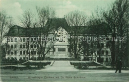 12982646 Basel BS Strassburger Denkmal Mit De Wette Schulhaus Basel BS - Sonstige & Ohne Zuordnung