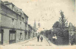 14 - La Délivrande - Une Rue - Animée - Oblitération Ronde De 1922 - CPA - Voir Scans Recto-Verso - La Delivrande