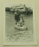 A Little Girl, A Boy In A Rubber Boat And A Woman At Sea - Anonymous Persons