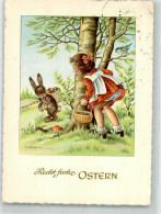 39884608 - Sign. Lambertz Maedchen Beobachtet Hasen Beim Verstecken Von Ostereiern Tiere Vermenschlicht Kuenstlerkarte - Pascua