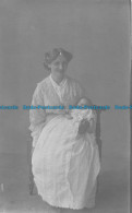 R075461 Woman Holding A Baby In Her Arms. Old Photography - World