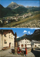 11466836 Scuol Panorama Mit Pisocgruppe Dorfplatz Brunnen Trachten Alpines Heilb - Other & Unclassified