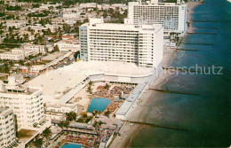 72956962 Miami_Beach Looking Along Oceanfront Hotels Deauville Carillion Aerial  - Autres & Non Classés