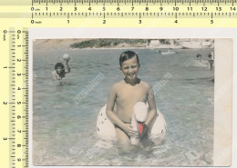 REAL PHOTO Boy Sitting On Inflatable Swan On Beach Garcon Assise Sur Cygne Gonflable Plage Colored Photo SNAPSHOT - Anonymous Persons