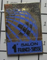 1818B Pin's Pins / Beau Et Rare / MARQUES / 1e SALON FRANCO-SUISSE De Quoi ? - Marcas Registradas