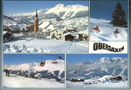 11890856 Obersaxen Meierhof Dorfpartie Mit Kirche Tiefschnee Skilaeufer Sesselli - Other & Unclassified