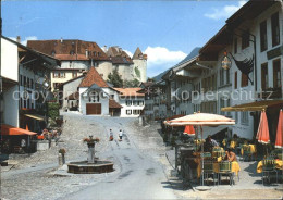 11889916 Gruyeres FR Dorfpartie Mit Brunnen Gruyeres - Altri & Non Classificati