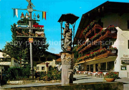 72886524 Ruhpolding Dorfplatz Maibaum Marienbrunnen Ruhpolding - Ruhpolding