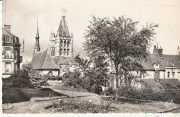 CPSM LAIGLE L' EGLISE SAINT MARTIN A TRAVERS LES ARBRES - L'Aigle