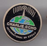 Pin's Charlie Echo International Dx Group   Réf 3192 - Mass Media