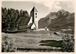 13904899 Fellers_Falera_GR Alte Kirche Mit Piz Riein - Altri & Non Classificati