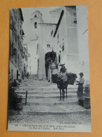 VILLEFRANCHE Sur MER -- La Rue De L'Eglise - Paysanne Provençale Sur Son âne Bâté - ANIMEE - Villefranche-sur-Mer