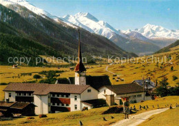 12807587 Muenster Goms Ortsansicht Mit Kirche Blick Zum Weisshorn Walliser Alpen - Sonstige & Ohne Zuordnung