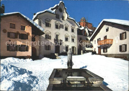 12233187 Scuol Tarasp Vulpera Dorfplatz Mit Brunnen Scuol - Autres & Non Classés