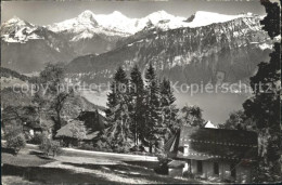 12364989 Beatenberg Ref Und Kath Kirche Thunersee Eiger Moench Jungfrau Beatenbe - Autres & Non Classés