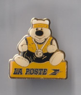 PIN'S  THEME  LA POSTE  UN OURSON ET SA MEDAILLE - Correo