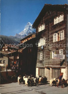 12016847 Zermatt VS Kirchplatz Mit Geissen Und Matterhorn  - Altri & Non Classificati