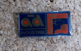 Pin's - Ad Industrie - Meubles, Abrasifs - Markennamen