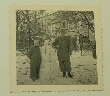 Two Boys Next To Snowman - Anonymous Persons