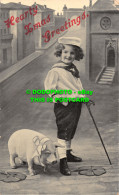 R466710 Hearty Xmas Greetings. Child With Pig. Postcard - World