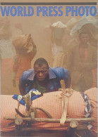 Carte Postale - World Press Photo (homme Poussant Un Chargement) - Photographs