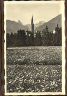 11305075 Davos GR Im Kurpark Kirche Graubuenden Davos - Autres & Non Classés