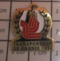 912e Pin's Pins / Beau Et Rare / TRANSPORTS / TRANSPORTEUR DE L'ANNEE 1992 - Transportes