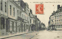 62 - Aire Sur La Lys - Grand'Place Et Rue De Biennes - Animé - Ecrite En 1916 - CPA - Voir Scans Recto-Verso - Aire Sur La Lys