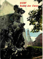 03 - Vichy - La Statue De La Déesse Des Eaux - Au Fond L'église Saint-Biaise - CPM - Carte Neuve - Voir Scans Recto-Vers - Vichy