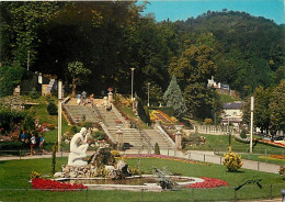 65 - Bagnères De Bigorre - Jardins De L'Esplanade Des Thermes - Statue De Femme Nue - La Buveuse - CPM - Voir Scans Rect - Bagneres De Bigorre