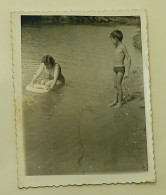 A Boy And A Woman On The River - Anonymous Persons