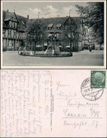 Ansichtskarte Wolfenbüttel Brunnen, Geschäfte - Uhr 1937 - Wolfenbüttel