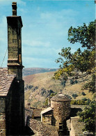 48 - Barre Des Cévennes - Le Clocher De L'église Et Le Village. Au Fond, Les Cévennes - CPM - Carte Neuve - Voir Scans R - Sonstige & Ohne Zuordnung