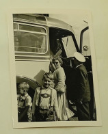 Two Boys And A Woman Enter The Bus - Personas Anónimos